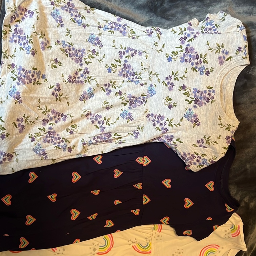 Six dresses, four with flowers and two with rainbows